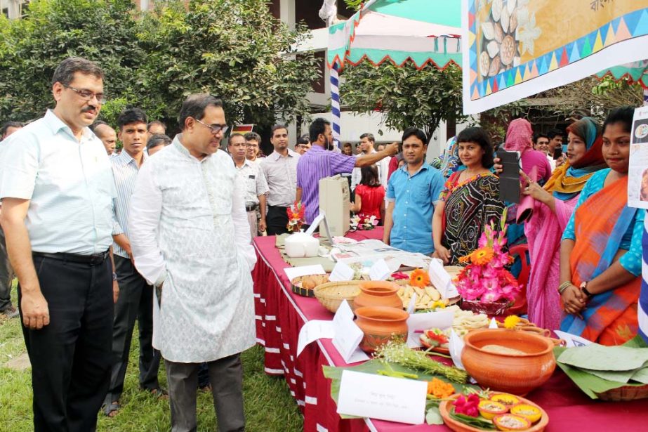 Vice-Chancellor of Bangladesh Open University Prof Dr M A Mannan visits the stall of a Pitha Mela organized by the University on last Thursday.