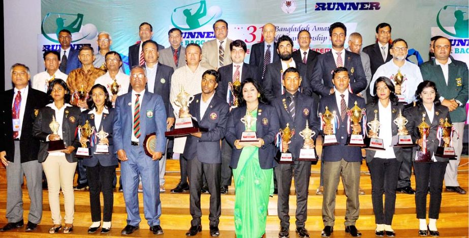 The winners of the 31st Bangladesh Amateur Golf Championship with Chief of Air Staff of Bangladesh Air Force Air Marshal Abu Esrar pose for a photograph at the Banquet Hall of Kurmitola Golf Club in Dhaka Cantonment on Sunday.