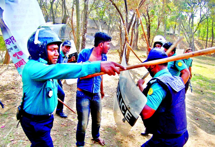 Law enforcers trying to bring the situation under control by arresting a BCL activist during collision between two groups of BCL at Sylhet MC College on Monday.