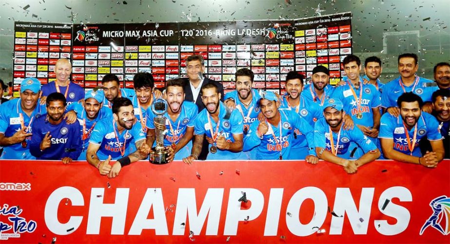 Players of India Cricket team celebrate with the Asia Cup trophy after beating Bangladesh at the Sher-e-Bangla National Cricket Stadium in Mirpur on Sunday.