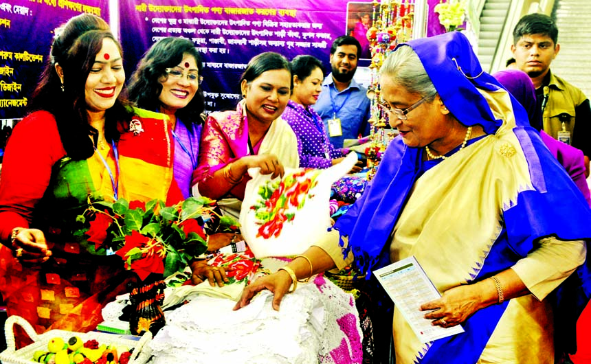 Prime Minister Sheikh Hasina, visiting women made goods at stalls on the occasion of International Women's Day at Bangabandhu conference center in the city on Tuesday.