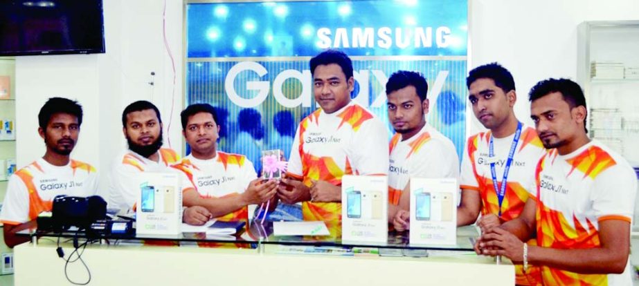 SYLHET: K M Woyaresur Rahman Area Manager, Sylhet Zone, Samsung Mobile Bangladesh lunching Galaxy J1 Nxt handset at Manru shopping centre in Sylhet city on Monday.