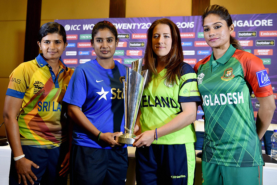 Team captains Shashikala Siriwardene, Mithali Raj, Isobel Joyce and Jahanara Alam pose with the Women's World T20 trophy at Bangalore on Wednesday.