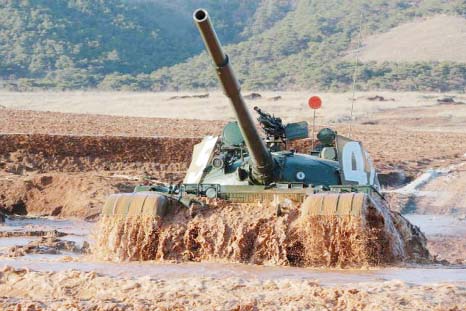 A tank is seen during the Korean People's Army (KPA) tank crews' competition at an unknown location, in this undated photo released by North Korea's Korean Central News Agency (KCNA) in Pyongyang on Friday.