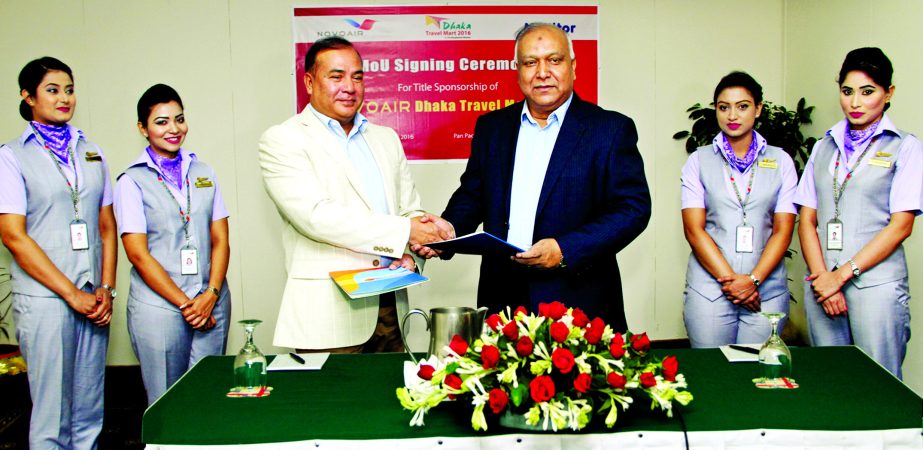 Kazi Wahidul Alam, Editor the Bangladesh Monitor and Gr Capt Mofizur Rahman, afwc, psc (Retd) exchanging documents of the title sponsorship of international tourism fair- Dhaka Travel Mart-2016 at a ceremony at a local hotel in Dhaka on saturday. The Bang