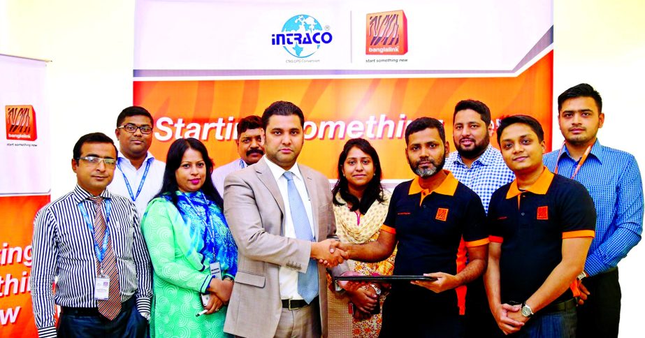 Md Mahbubul Alam Bhuiyan, Head of CBM - B2C, Marketing of Banglalink and Mohammed Irad Ali, Deputy Managing Director, Intraco CNG, exchanging agreement documents at Tigers Den, head office of Banglalink in Dhaka on Saturday. Under this agreement Banglalin