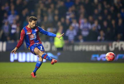 Crystal Palace's Yohan Cabaye scores his side's first goal from the penalty spot during their English FA Cup, quarter final soccer match against Reading at the Madejski Stadium in Reading on Friday.
