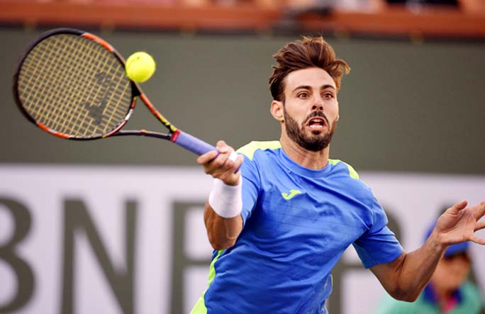 Marcel Granollers of Spain returns a shot from Andy Murray during their match at the BNP Paribas Open tennis tournament on Saturday in Indian Wells, Calif.