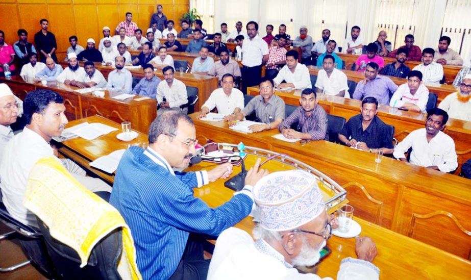 CCC Mayor A J M Nasir Uddin speaking at view-exchange meeting with members of hawkers at KB Abdus Sattar Auditorium on Sunday.