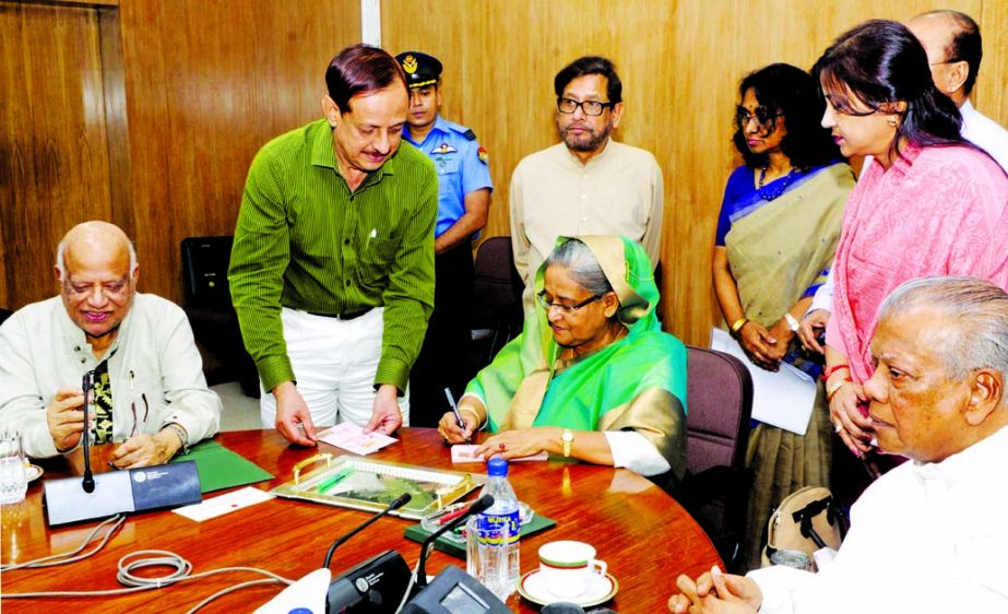 Prime Minister Sheikh Hasina releases commemorative postage stamp on 100th death anniversary of mystic Poet Radharaman Dutta at Bangladesh Secretariat on Monday. BSS photo