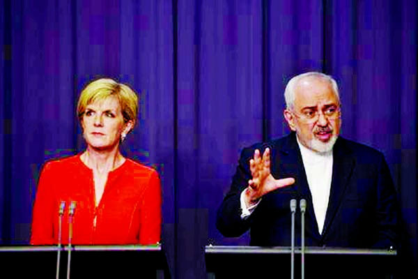 Australian Foreign Minister Julie Bishop (L) and Iranian Foreign Minister Mohammad Javad Zarif speak during a news conference at Australia's Parliament House in Canberra on Tuesday.