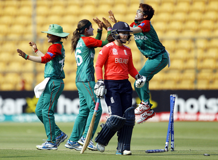 Bangladesh players celebrate the dismissal of England's Tammy Beaumont (second right) during their ICC Women's Twenty20 2016 Cricket World Cup match in Bangalore, India on Thursday.