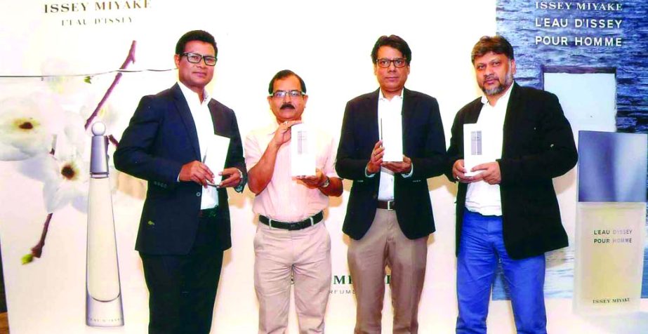 Members of Bangla Perfumes Distributors Ltd are seen posing in an inaugural ceremony of 'ISSEY MIYAKE', a Japan origin fragrance in a city hotel on Wednesday.