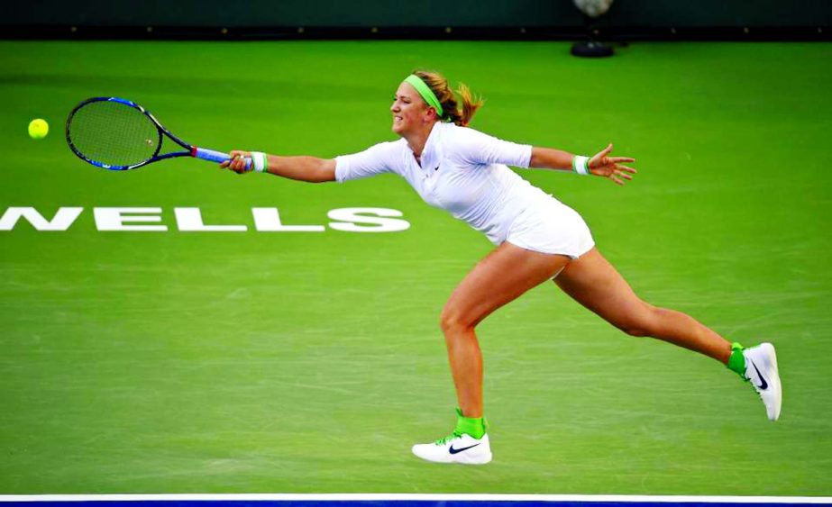 Victoria Azarenka of Belarus returns a shot to Magdalena Rybarikova of Slovakia at the BNP Paribas Open tennis tournament in Indian Wells, Calif on Thursday.