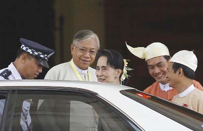 Myanmar's newly elected president Htin Kyaw (2nd L) and National League for Democracy (NLD) party leader Aung San Suu Kyi (C) leave the parliament at Naypyitaw.