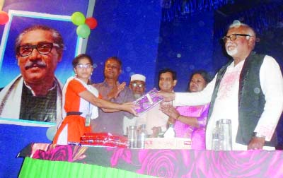 GOURIPUR(Mymensingh): Former State Minister For Heath and Family Welfare freedom fighter Alhaj Capt(Retd)Mujibur Rahman Fakir MP distributing prizes among the winners of the cultural completion on the occasion of the 97th birth anniversary of Bangabandh