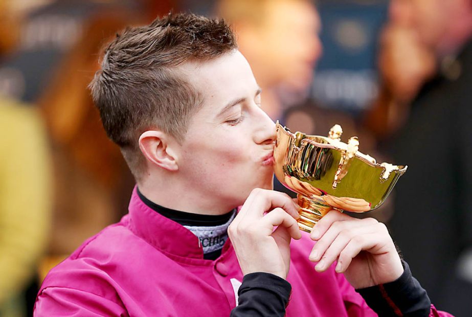 Jockey Bryan Cooper kisses the Gold Cup after winning the Cheltenham Gold Cup Chase on Don Cossack on Gold Cup Day during the Cheltenham Festival at Cheltenham Racecourse, England on Friday .