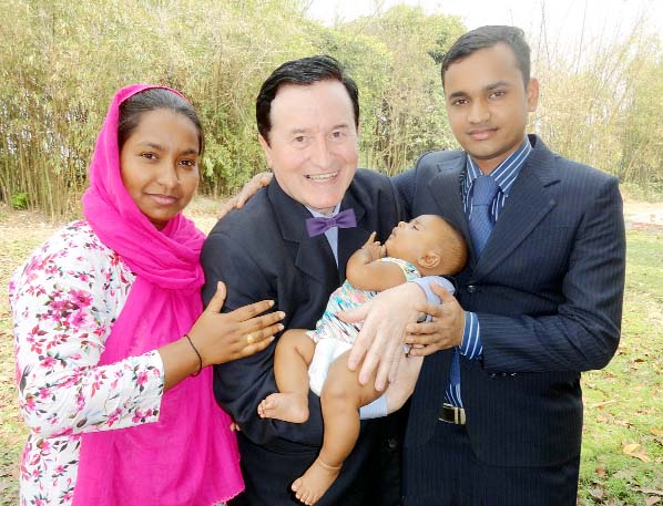 (L-R) Shahida Azad (Mum), Sir Frank Peters (holding his Frank Peters Azad Ali) and Azad Hossan (Dad).