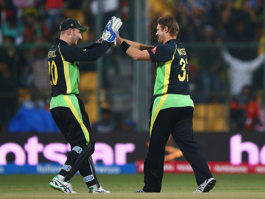 Peter Nevill and Shane Watson celebrate the wicket of Soumya Sarkar during the World T20, Group 2 match between Australia and Bangladesh at Bangalore in India on Monday.