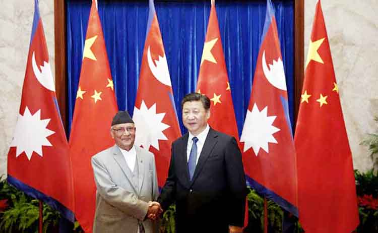 Nepalese Prime Minister KP Oli shaking hands with Chinese President Xi Jinping in Beijing on Monday.