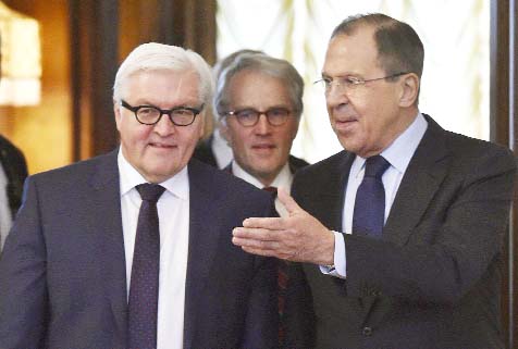 Russian Foreign Minister Sergey Lavrov, right, welcomes Germany's Foreign Minister Frank-Walter Steinmeier prior a meeting in Moscow on Wednesday.