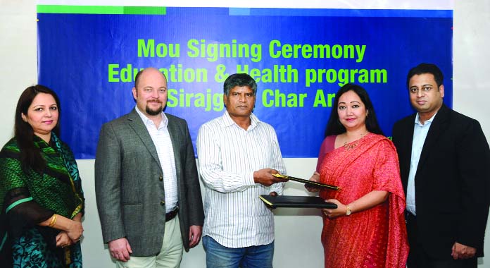 Ms. Bitopi Das Chowdhury, Country Head of Corporate Affairs of Standard Chartered Bank, Bangladesh and Md. Habibullah Bahar, Director of MMS exchanging agreements on behalf of their respective organizations to launch Comprehensive Education and Health Pro