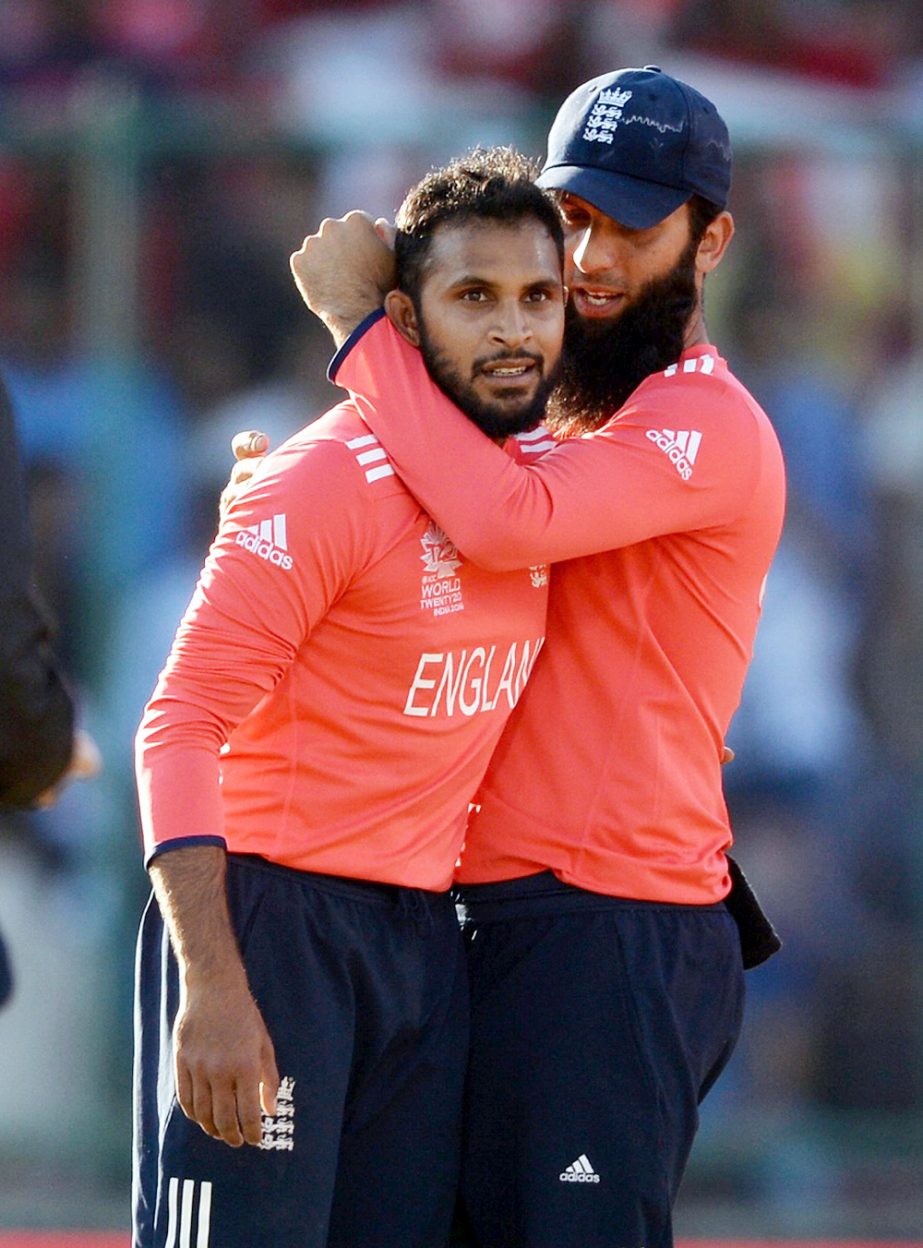 Moeen Ali and Adil Rashid celebrate a wicket during the ICC World Twenty20 Group 1 match between England and Afghanistan at Feroz Shah Kotla Ground in Delhi, India on Wednesday. England beat Afghanistan by 15 runs.