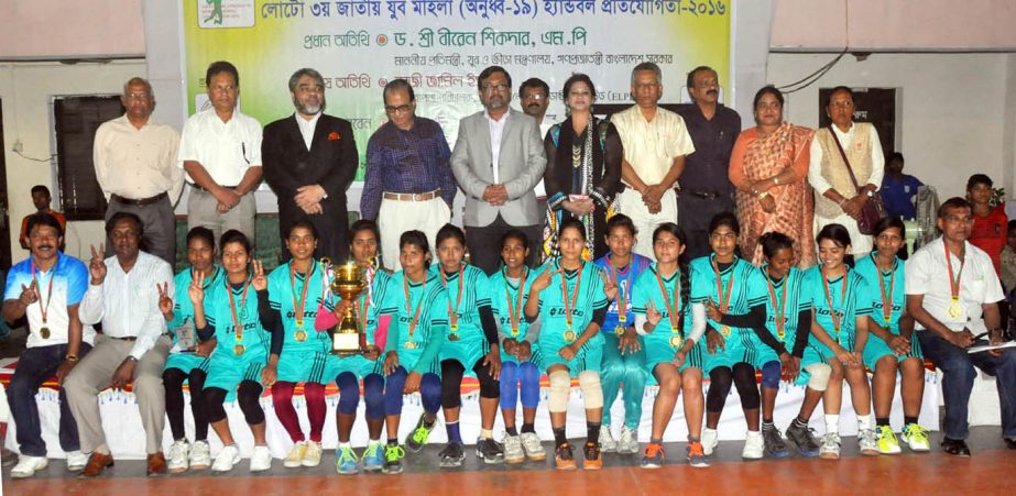 BJMC, the champions of the Lotto 3rd National Youth (Under-19) Women's Handball Competition with the guests and the officials of Bangladesh Handball Federation pose for a photo session at the Shaheed (Captain) M Mansur Ali National Handball Stadium on We