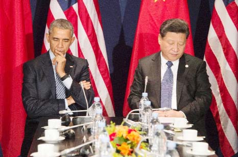 US President Barack Obama (L) sits with Chinese President Xi Jinxing during their meeting in Le Bourget, France.
