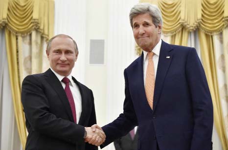 US Secretary of State John Kerry, right, shakes hands with Russian President Vladimir Putin at the Kremlin in Moscow, Russia on Thursday.