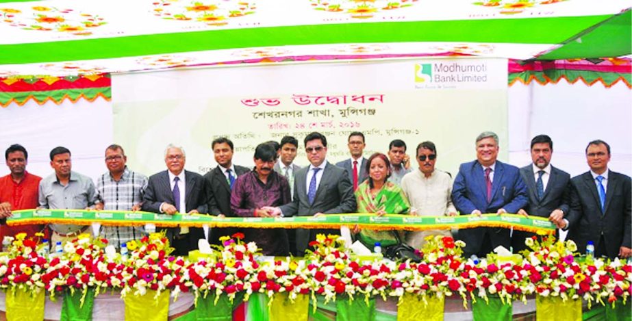 Sukumar Ranjan Ghosh, MP, Munshigonj-1 inaugurating its 17th branch at Shekharnagar, Munshigonj on Thursday. Barrister Sheikh Fazle Noor Taposh MP, Chairman, Executive Committeeof the Board of Directors of the Bank presided over the ceremony. Md MizanurRa