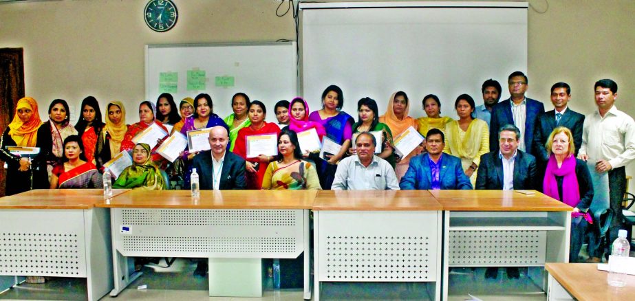 Nasreen Fatema Awal, Founder President, WEAB; Cezar Dragutan, Chief Technical Advisor, ILO; Mousumi Islam, President, AGWEB, Shamsun Nehar, Chairperson, FWBWF, and Zaman Mollah, General Manager, BBTA pose with the participants of a programme on "Genera