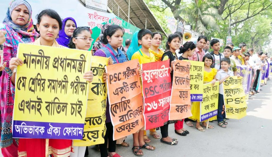 Avivabok Oikya Forum formed a human chain in front of Jatiya Press Club on Friday demanding cancellation of Primary School Certificate examination.