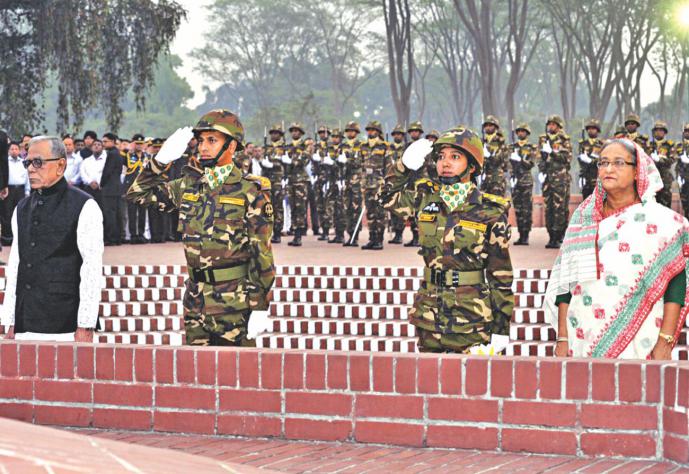 President Abdul Hamid and Prime Minister Sheikh Hasina stand in solemn silence while paying tribute to the Liberation War martyrs at the National Memorial in Savar on the Independence Day. Photo: BSS