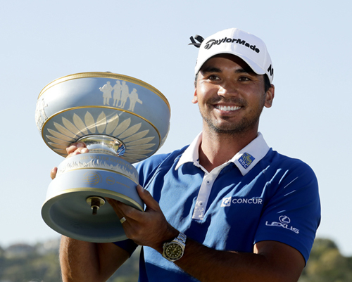 Jason Day of Australia holds the trophy after winning the Dell Match Play Championship golf tournament at Austin Country Club in Austin, Texas on Sunday.