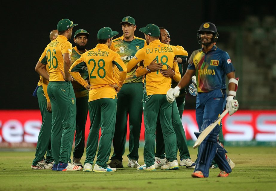South Africa get together to celebrate the wicket of Dinesh Chandimal during the ICC World Twenty20 India 2016 Super 10s Group 1 match between South Africa and Sri Lanka at the Feroz Shah Kotla Cricket Ground in Delhi, India on Monday.