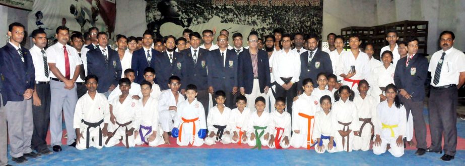 The winners of the Independence Day Karate Competition with the guests and the officials of Bangladesh Karate Federation pose for a photo session at the Gymnasium of the National Sports Council on Tuesday.