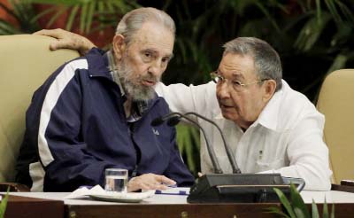 Fidel Castro, left, and Cuba's President Raul Castro talk during the 6th Communist Party Congress in Havana, Cuba..