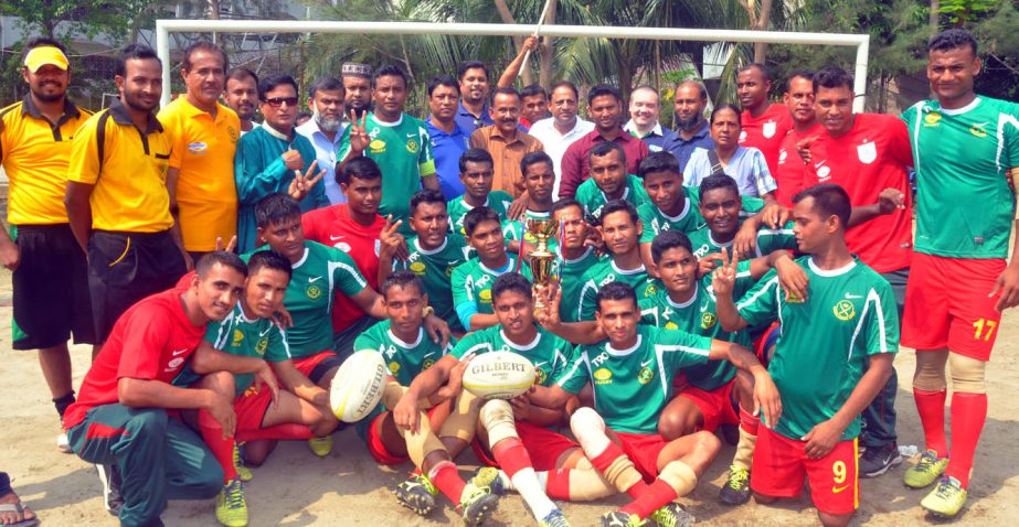 Bangladesh Army, the champions of the Independence Day Rugby Competition with the guests and the officials of Bangladesh Rugby Federation pose for a photo session at the Paltan Maidan on Wednesday.