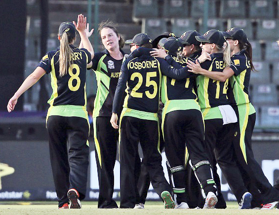 Australian players celebrate their victory against England during their ICC women Twenty20 2016 Cricket World Cup semifinals match at the Feroz Shah Kotla Cricket Stadium in New Delhi, India, Wednesday. Australia won by 5 runs.