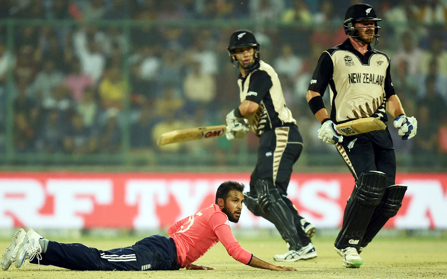 Adil Rashid, Corey Anderson and Ross Taylor look on as the ball flies away during the first semifinal battle of the ICC World Twenty20 at Feroz Shah Kotla Stadium in Delhi on Wednesday. New Zealand scored 153for 8 in 20 overs.