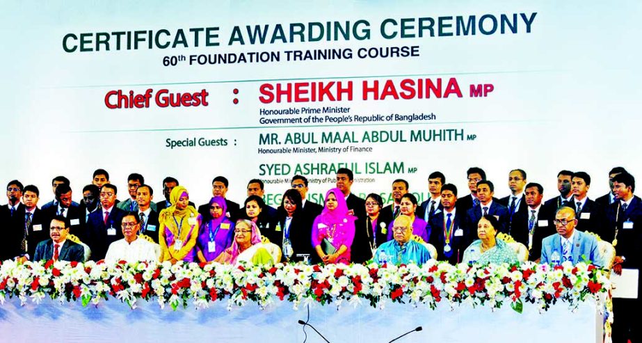 Prime Minister Sheikh Hasina poses for photograph with the participants of 6oth Foundation Training Course held at Bangladesh Public Administration Training Center and other distinguished guests at a ceremony organized for awarding certificates among the