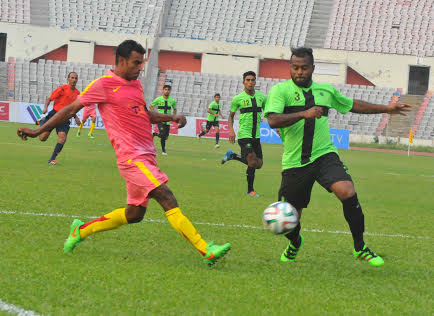 A scene from the football match of the KFC Independence Cup between Team BJMC and Rahmatganj MFS at the Bangabandhu National Stadium on Friday.