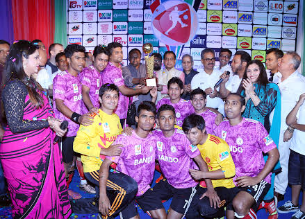 Bando Design, the champions of the maiden edition BGMEA Cup Football Tournament with the guests and officials of BGME pose for a photograph at Bangladesh Army Stadium on Friday.