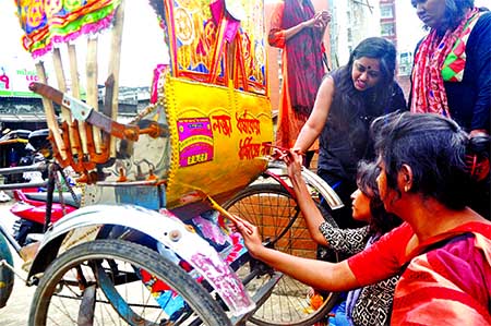 Activists of women's rights organization on Friday took to the city streets protesting sexual assaults on women. They put slogan behind rickshaws as part of their protests. The photo was taken from Ananda Bazar area in the capital.