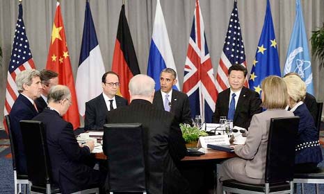 British Prime Minister David Cameron, French President Francois Hollande, US President Barack Obama and China's President Xi Jinping take part in a P5+1 meeting during the Nuclear Security Summit in Washington.