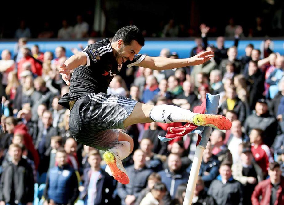 Chelsea's Pedro celebrates scoring his side's fourth goal of the game during their English Premier League soccer match against Aston Villa at Villa Park, Birmingham, England on Saturday.