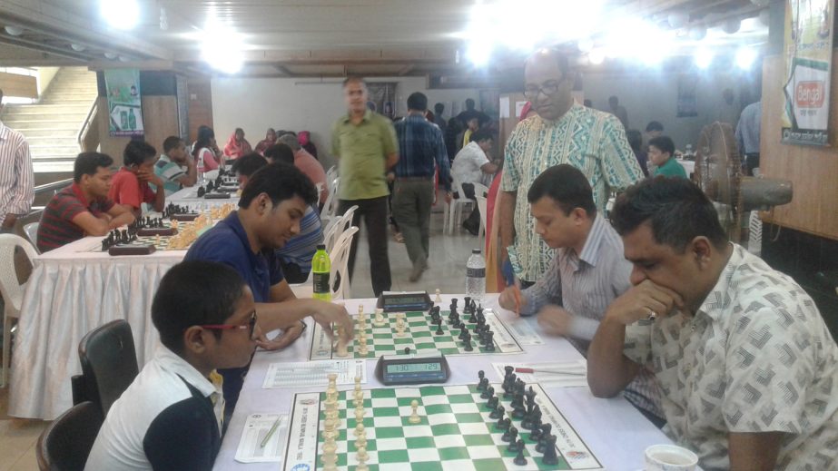 GM Ziaur Rahman of Bangladesh Navy (right) in action against FM Mohammad Fahad Rahman of Sheikh Russel Memorial Club (left) during their 8th round games of the Amin Mohammad Group & AST Beverage Limited International Rating Chess Tournament at the Auditor