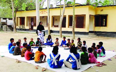 SIRAJGANJ: Students of Chariya Kandipara Government Primary School in Chariya Kandipara Upazila attending classes in the school field due to shortage of class room and educational stuff. This snap was taken yesterday.