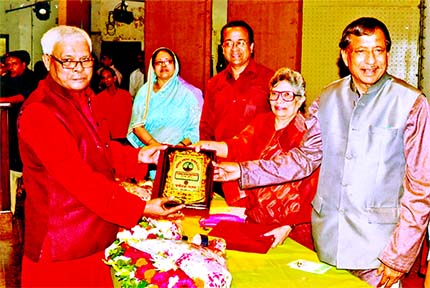 State Minister for Food Nuruzzaman Ahmad MP distributing Independence Citation to noted freedom fighter KSNM Jahurul Islam Khan organized by Swadhinata Sangsad at the Central Public Library auditorium in Shahbagh recently.